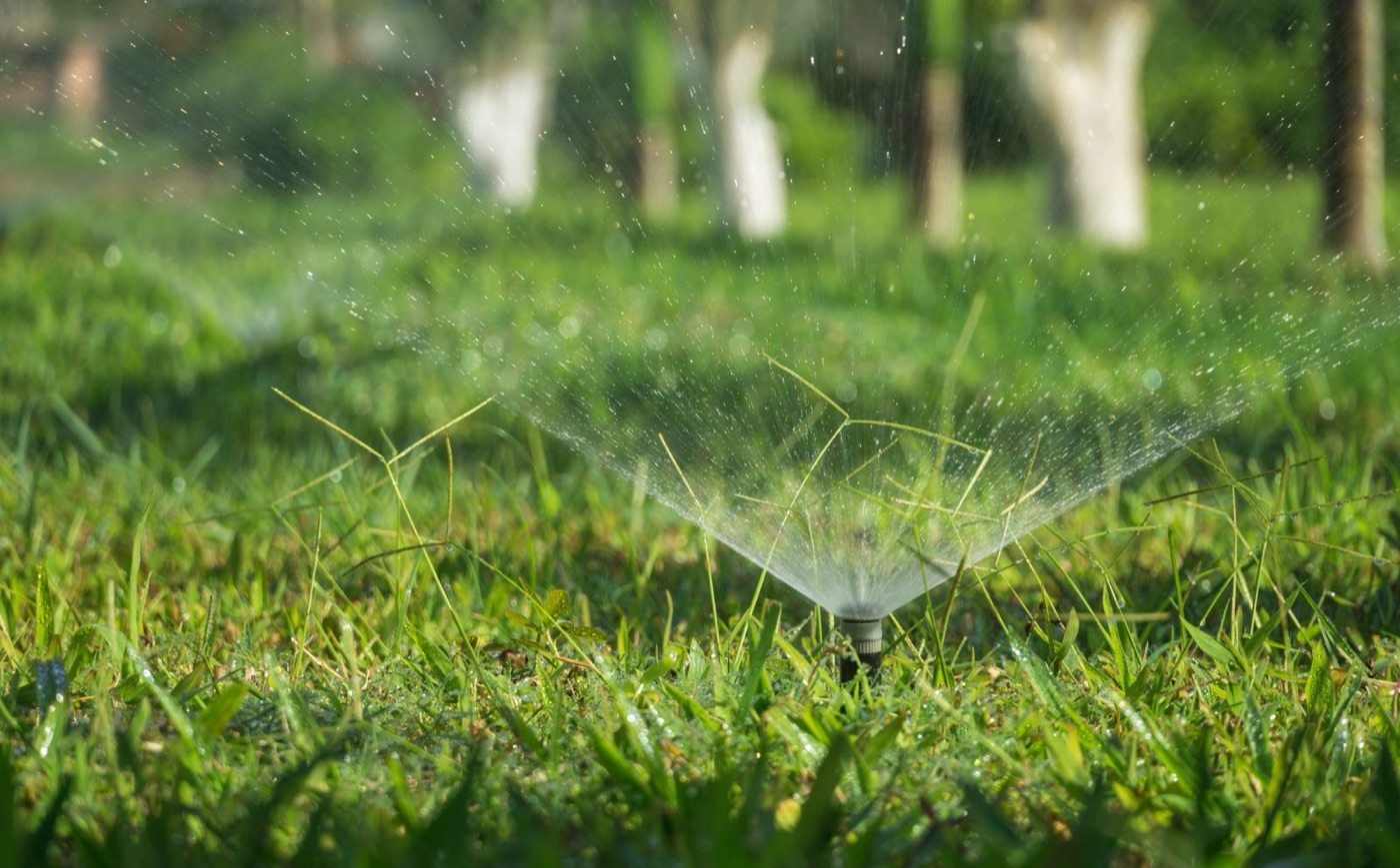 Garden reticulation sprinkler watering a lawn at a Kinross home Garden reticulation sprinkler watering a lawn at a Kinross home